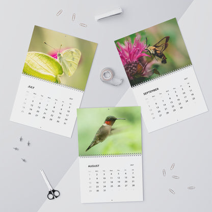 July through September pages of the Critters of Whimsy 2027 wall calendar, featuring a cabbage white butterfly, hummingbird, and hummingbird moth