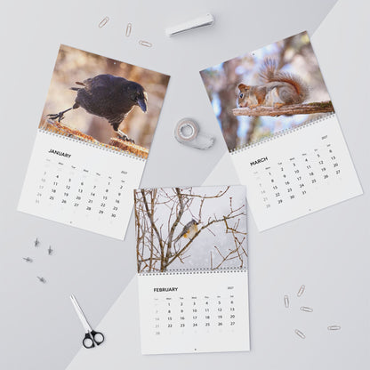 January through March pages of the Critters of Whimsy 2027 wall calendar, featuring a crow, a tufted titmouse bird and a red squirrel