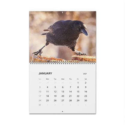 Critters of Whimsy 2027 wall calendar open to January, with a crow photograph above the monthly dates