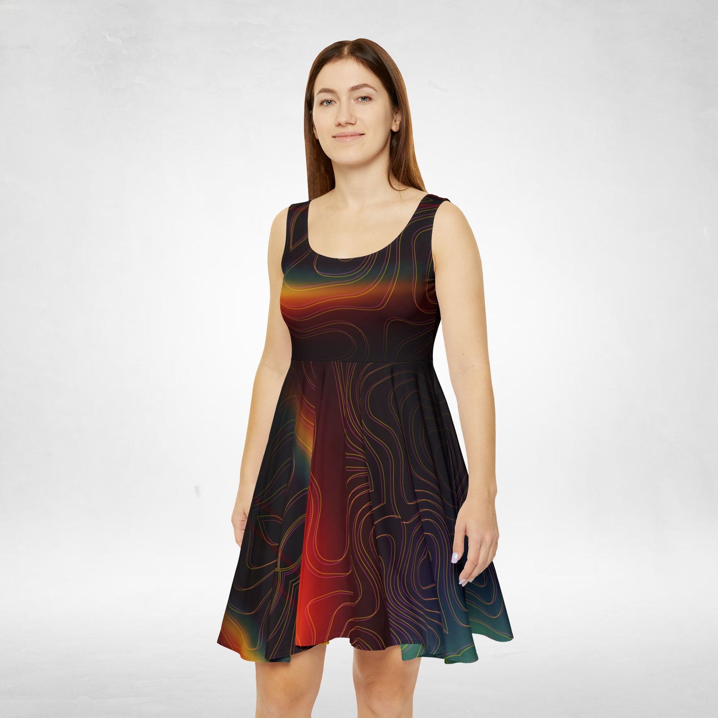 Woman wearing a sleeveless dress with a colorful abstract rainbow pattern on a white background